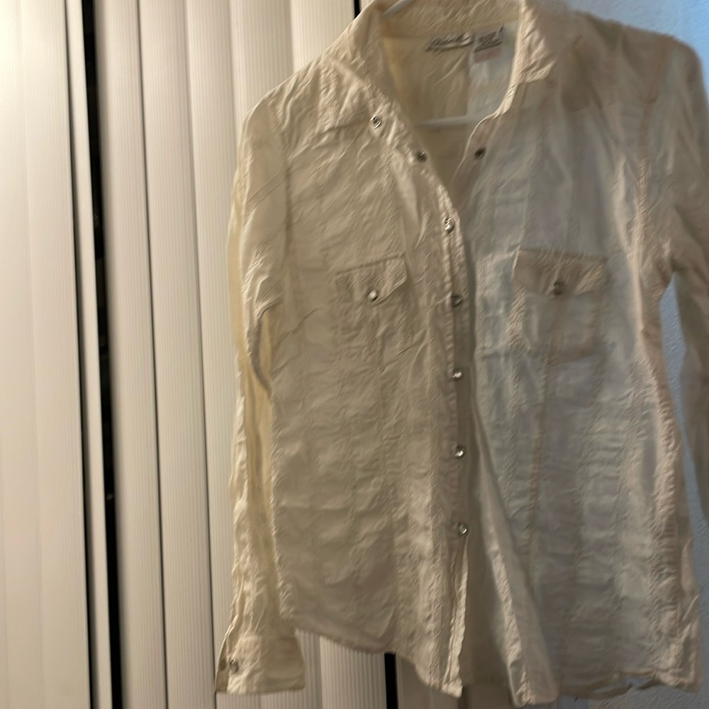 Great condition. Buttons on both cuffs